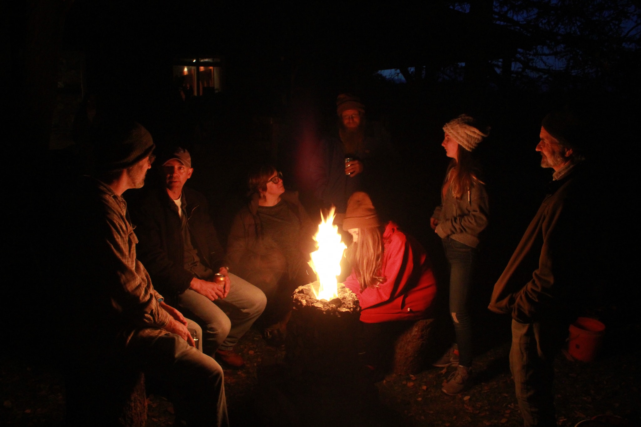 People connecting around a fire